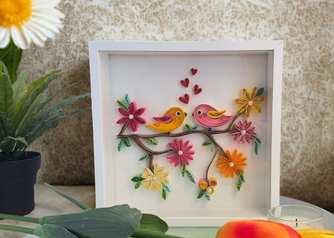pair of bird perched on branch in a white deep shadow frame