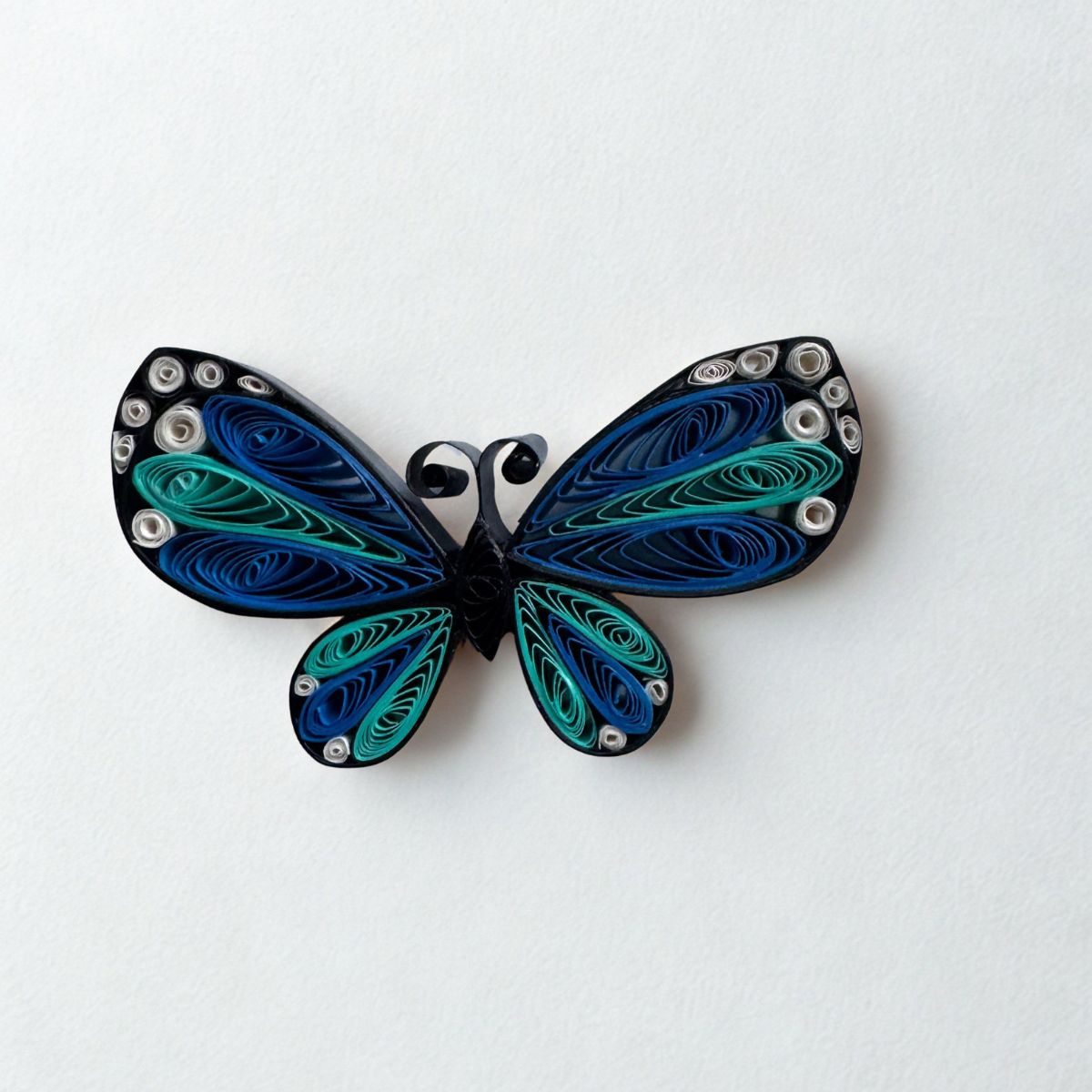 Handcrafted paper quilled butterfly fridge magnet available in Lavender Emperor, Blue Morpho, Emerald Swallowtail, Red Lacewing and Monarch colour variants.