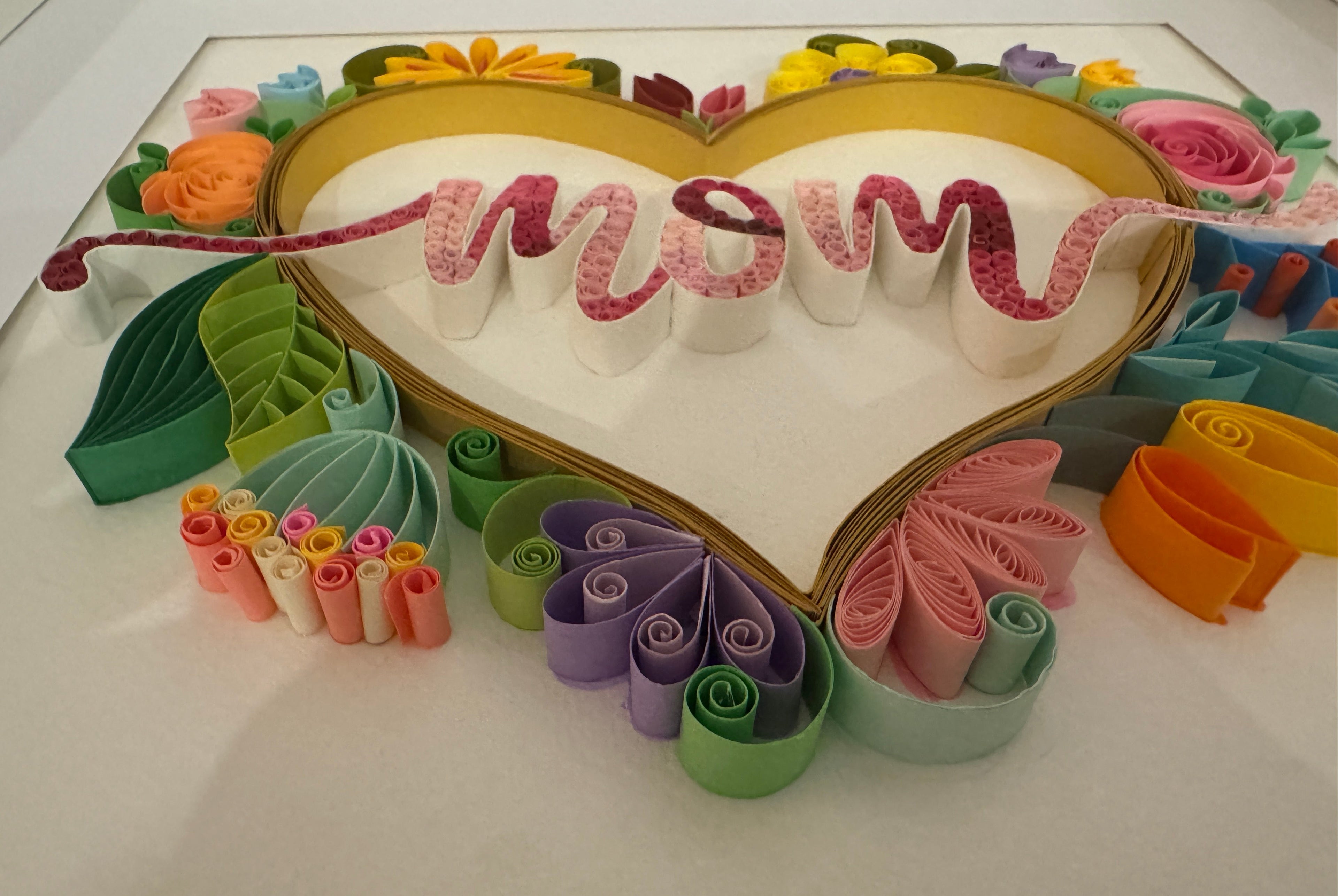 Close up of handmade paper quilling floral design on Mum wall art