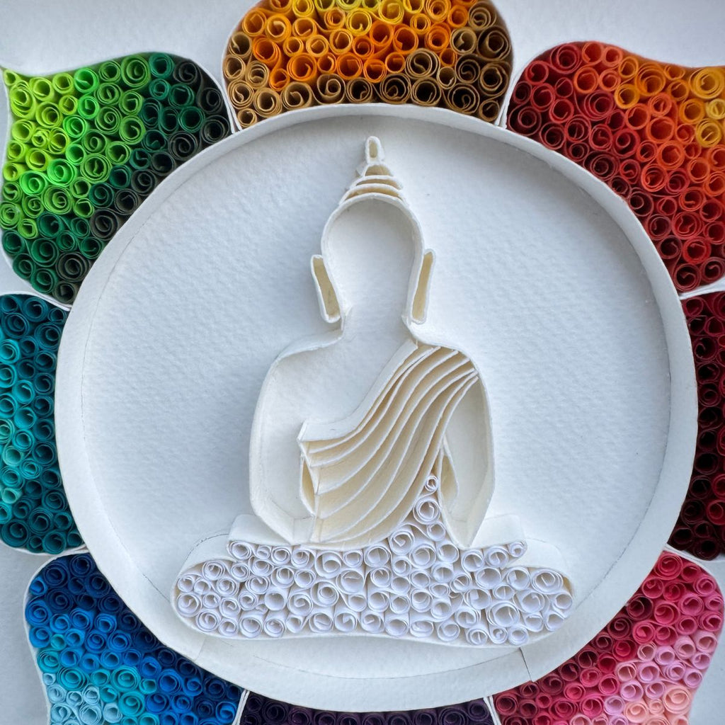 Handcrafted Radiant Lotus Buddha paper quilling wall art featuring a white Buddha silhouette surrounded by a vibrant rainbow lotus in a white shadow box frame.