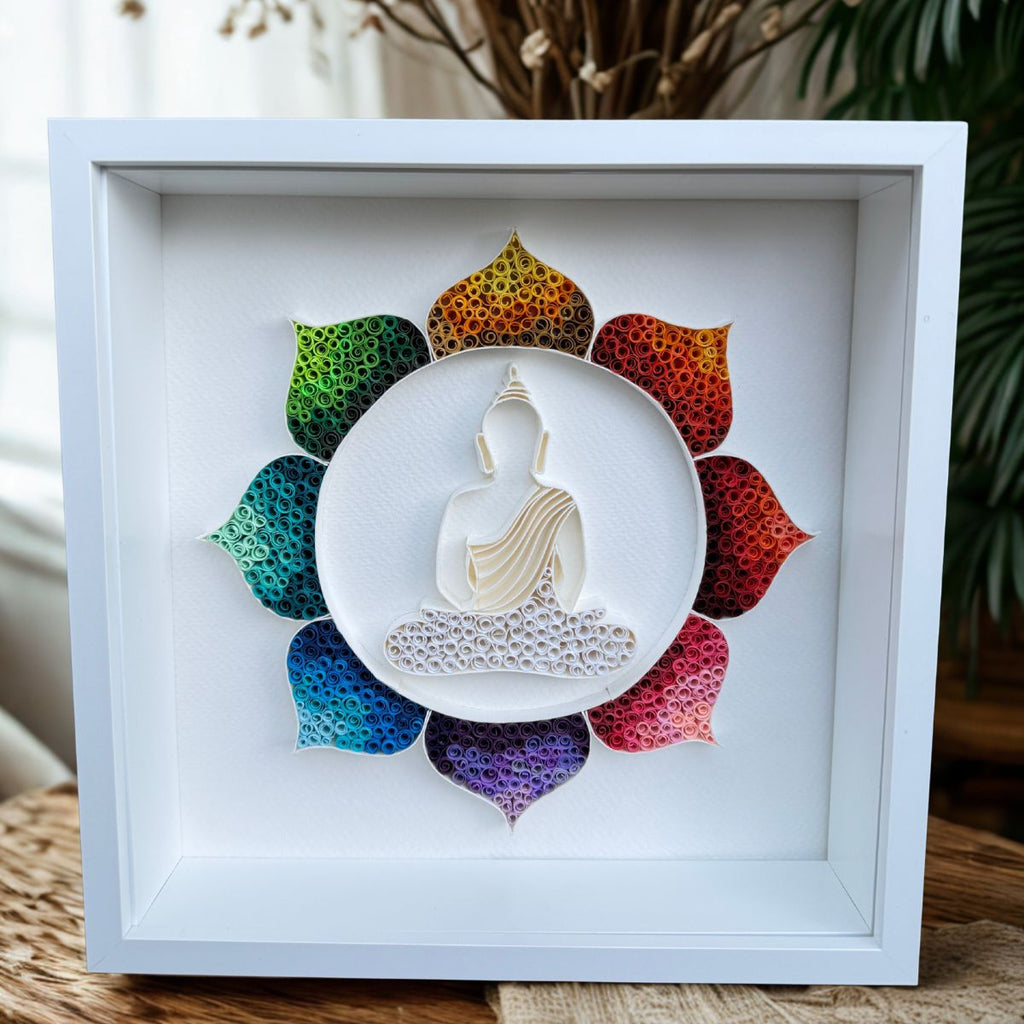 Handcrafted Radiant Lotus Buddha paper quilling wall art featuring a white Buddha silhouette surrounded by a vibrant rainbow lotus in a white shadow box frame.