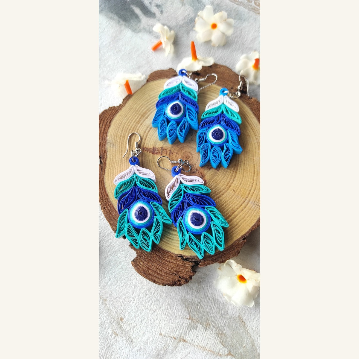 Teal and bright blue evil eye colour combinations handmade peacock feather paper quilling earrings