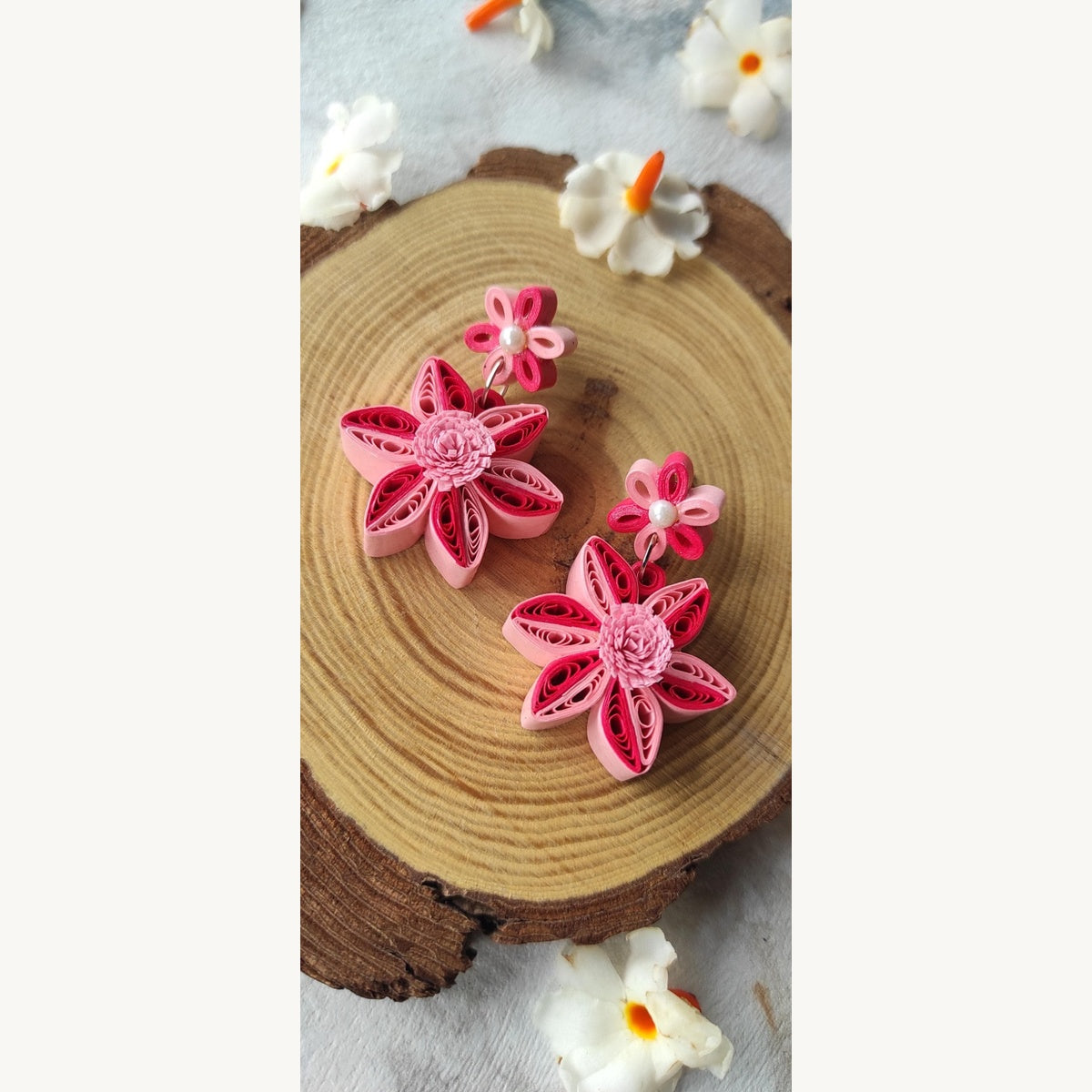 Handcrafted dark and light pink paper quilling flower stud drop earrings with two-tone petals and pearl-look accents.