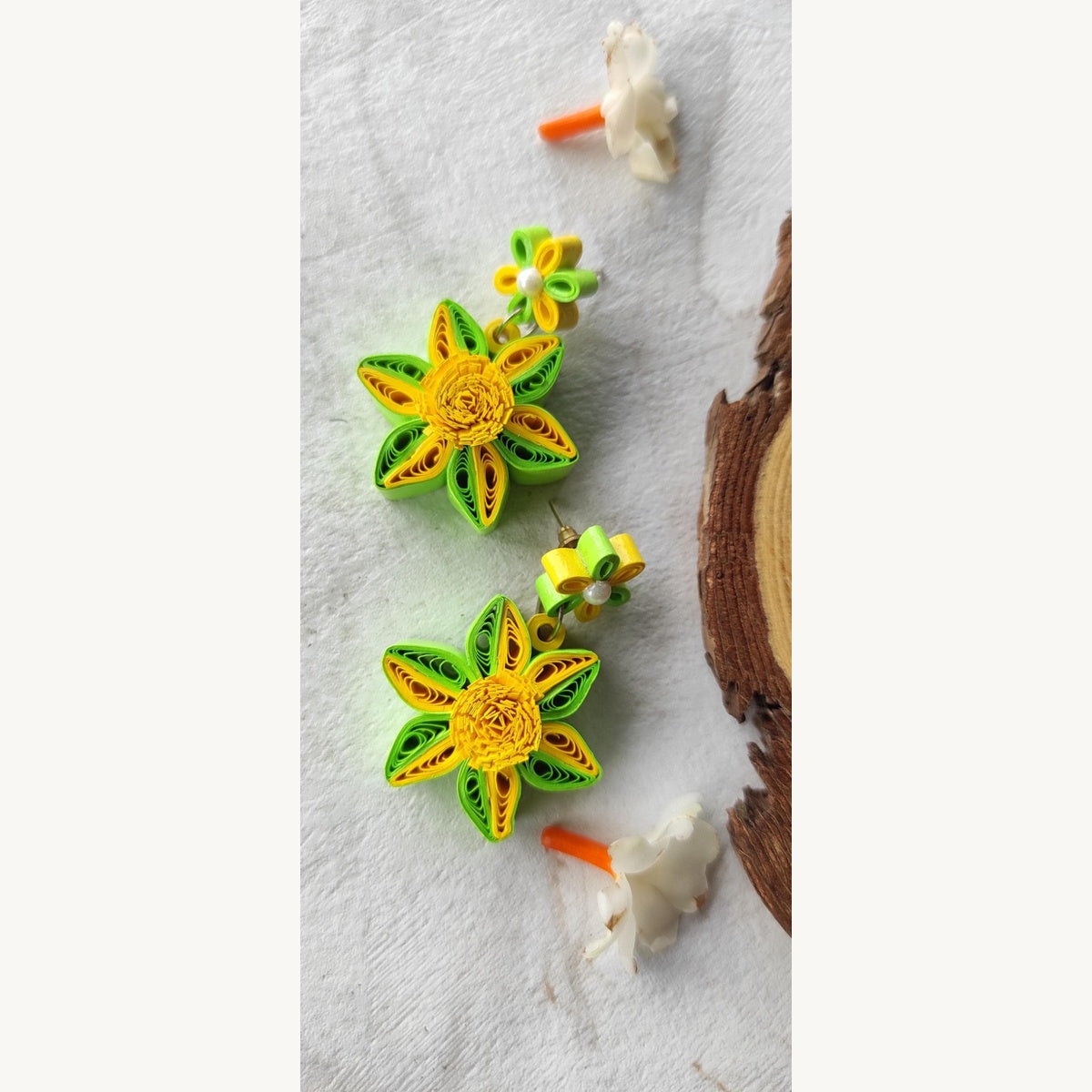 Handcrafted yellow green paper quilling flower stud drop earrings with two-tone petals and pearl-look accents.