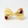 Single hand embroidered crimson rose with green leaf spray on lavender cotton bow by The Tranquil Folds