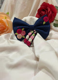 Handmade embroidered floral hair bow and matching hair clip set featuring artisan rose embroidery and botanical detailing, beautifully crafted for gifting and special occasions.