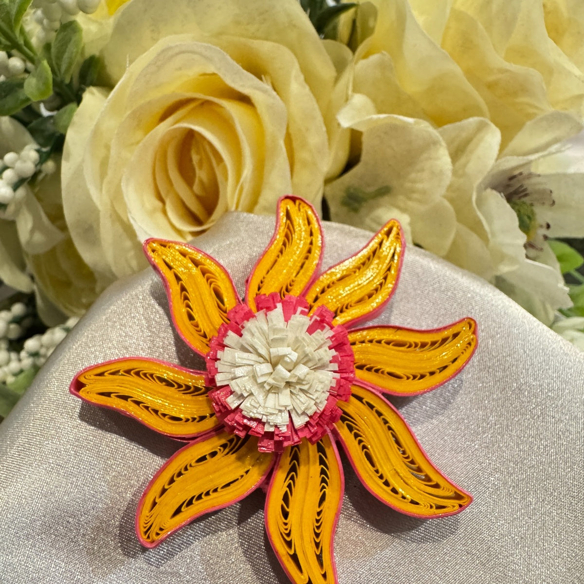 Handmade paper quilled flower fridge magnet in yellow, pink and white