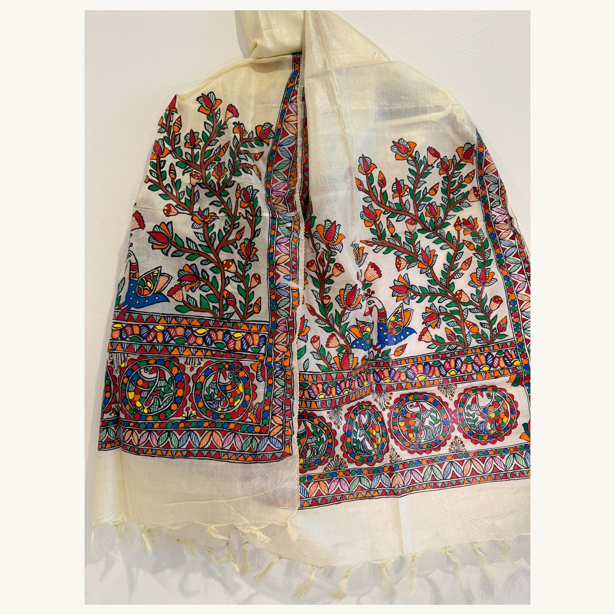 Ivory cream hand-painted Madhubani stole featuring peacocks fish floral motifs and tasselled ends