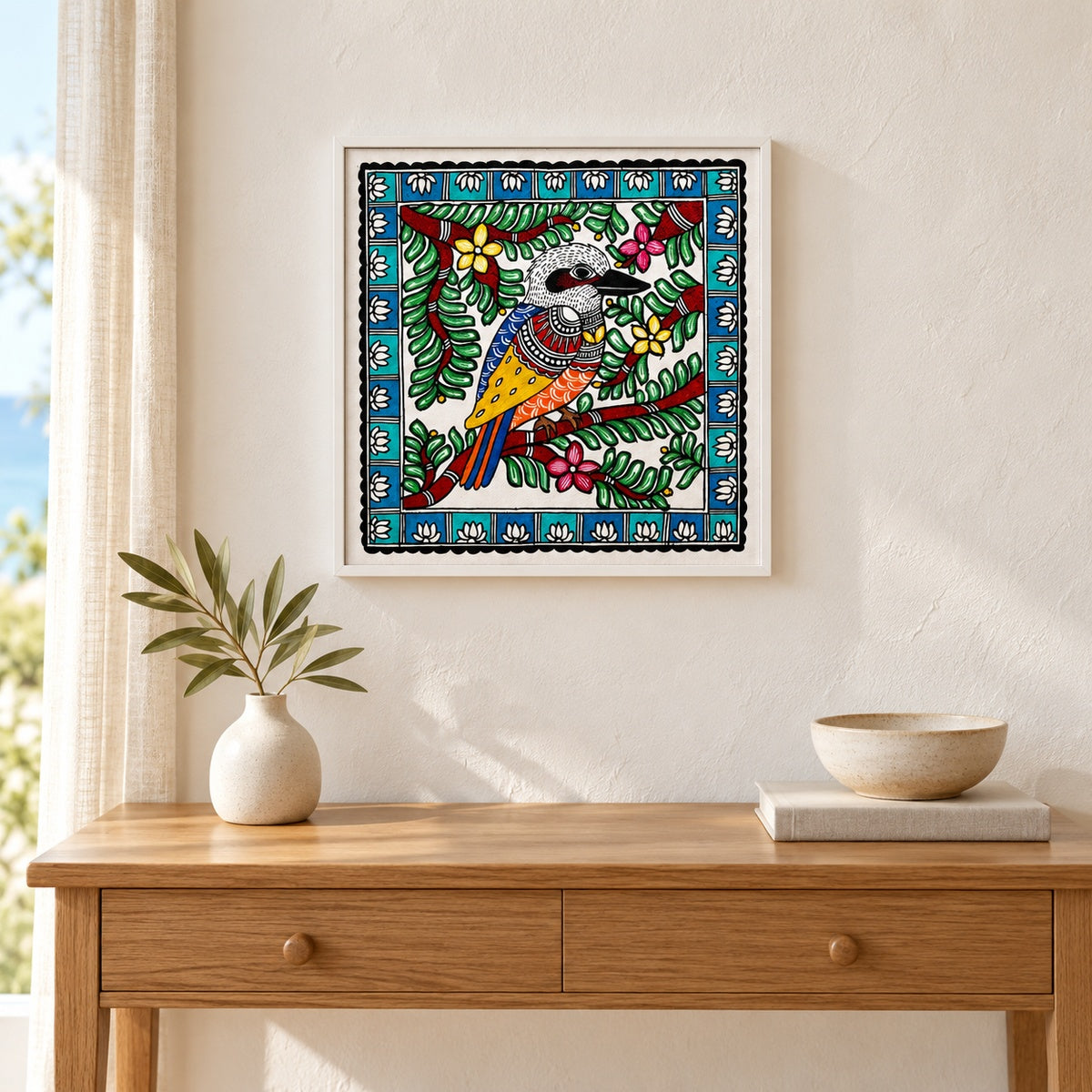 Among the Leaves kookaburra artwork in a white frame above an oak console