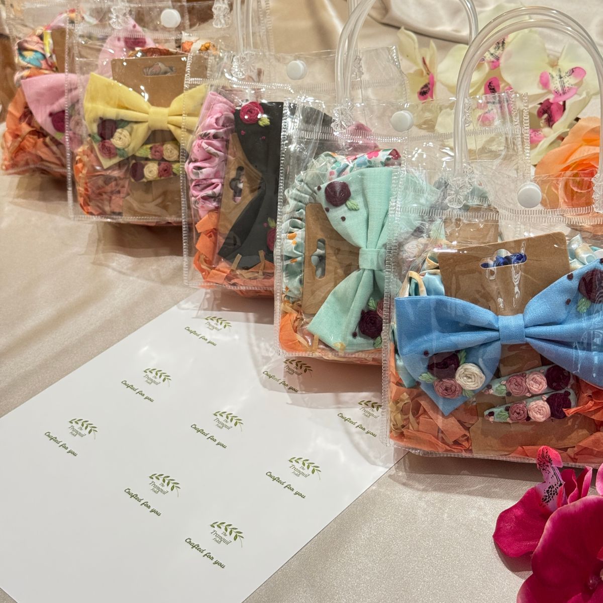 Little Bloom Hair Accessories Gift Set featuring embroidered floral hair clips, handmade embroidered hair bow, satin scrunchies and matching headband for girls.