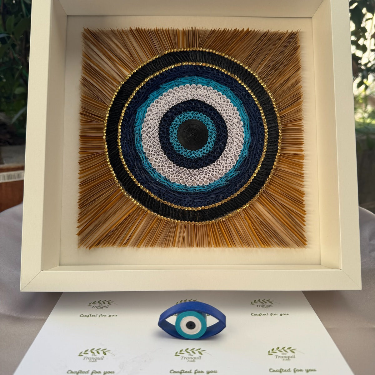 The Mindful Helix evil eye Nazar paper quilling wall art in blue white black and gold