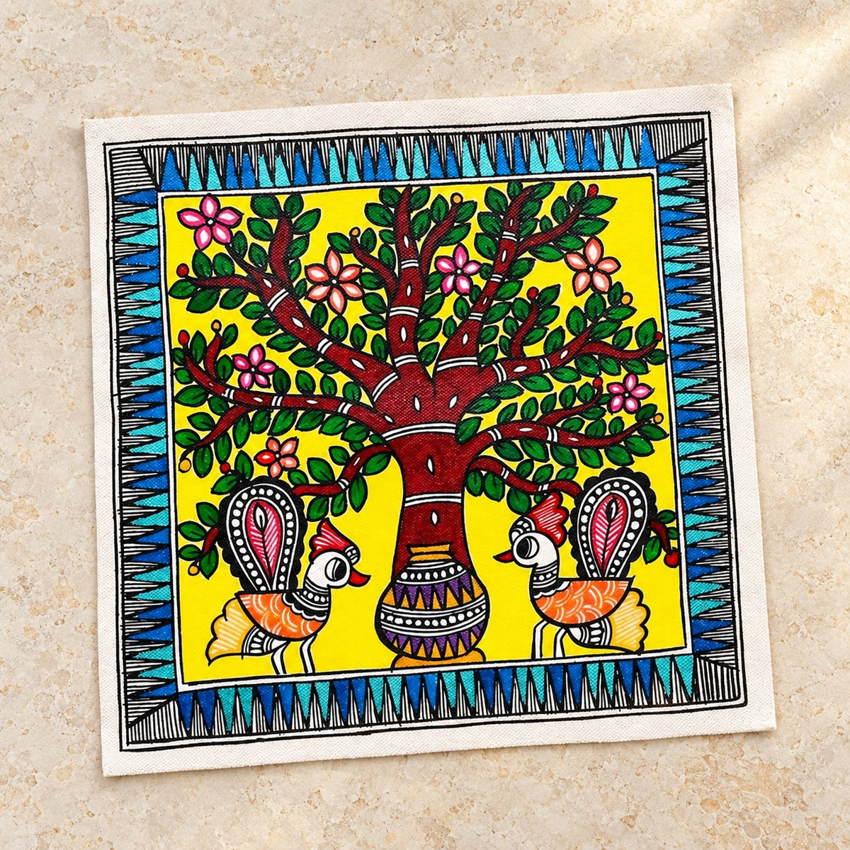 Unframed Madhubani-inspired peacock and tree painting on cloth canvas displayed on warm ivory limestone