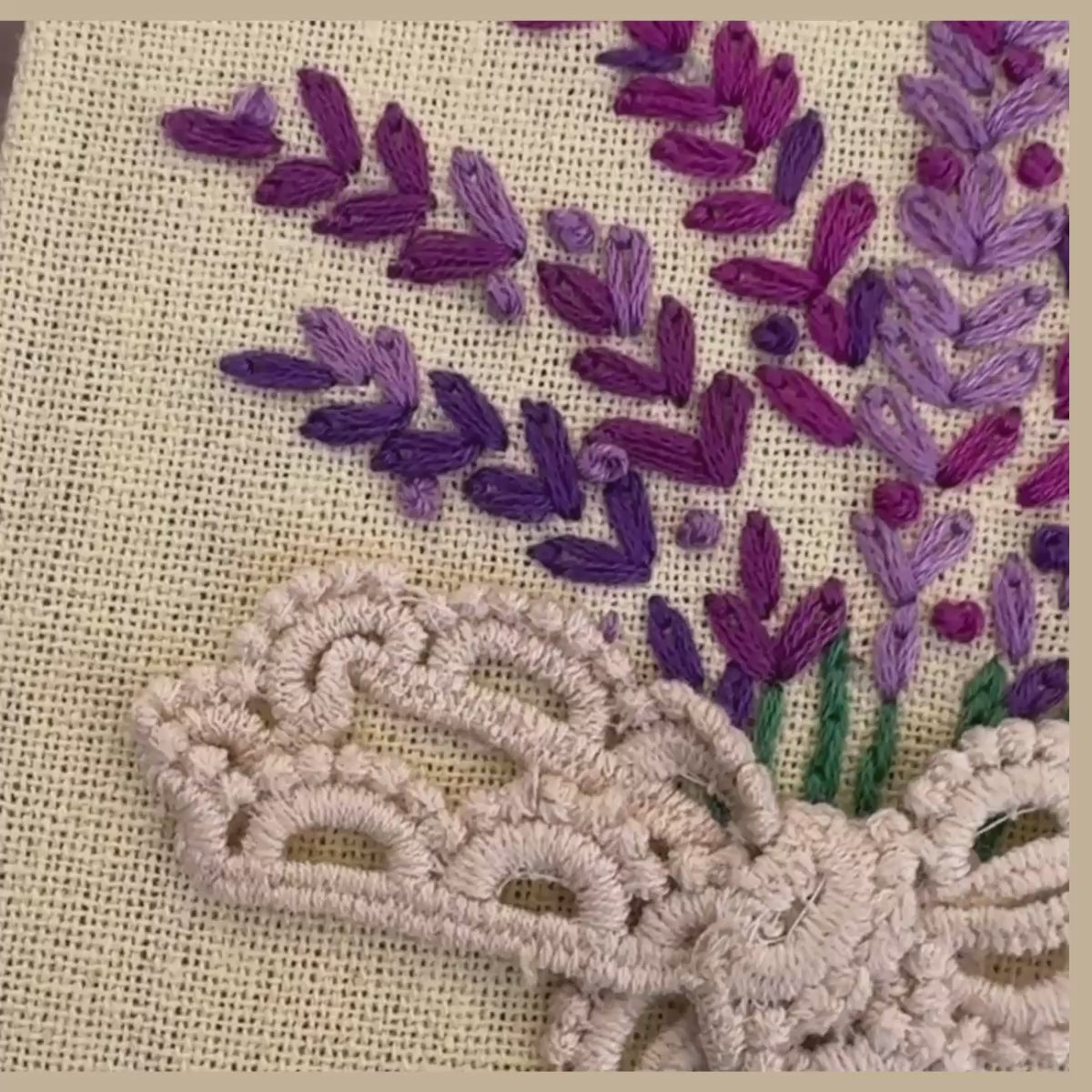 Hand embroidered lavender bouquet journal with lilac and violet stitched sprigs and crochet lace bow on lemon-yellow casement fabric cover.