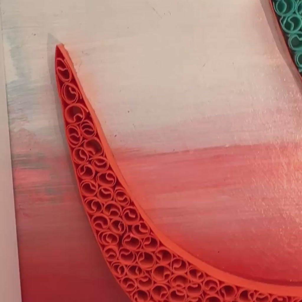 Handcrafted spiritual OM paper quilling artwork in teal, aqua, coral and warm orange tones, framed in white MDF