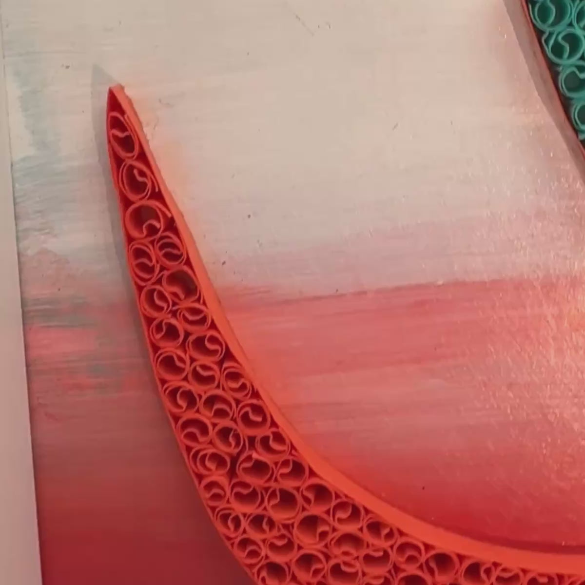 Handcrafted spiritual OM paper quilling artwork in teal, aqua, coral and warm orange tones, framed in white MDF
