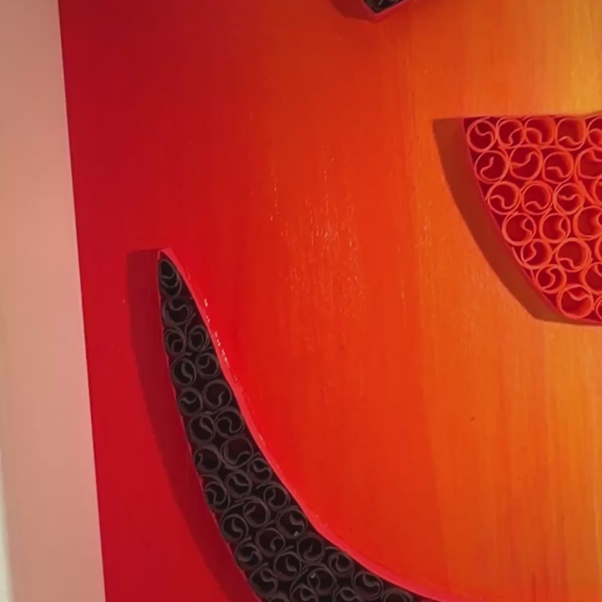 One-of-a-kind paper quilling OM artwork inspired by a red, orange and gold twilight horizon, framed in white MDF