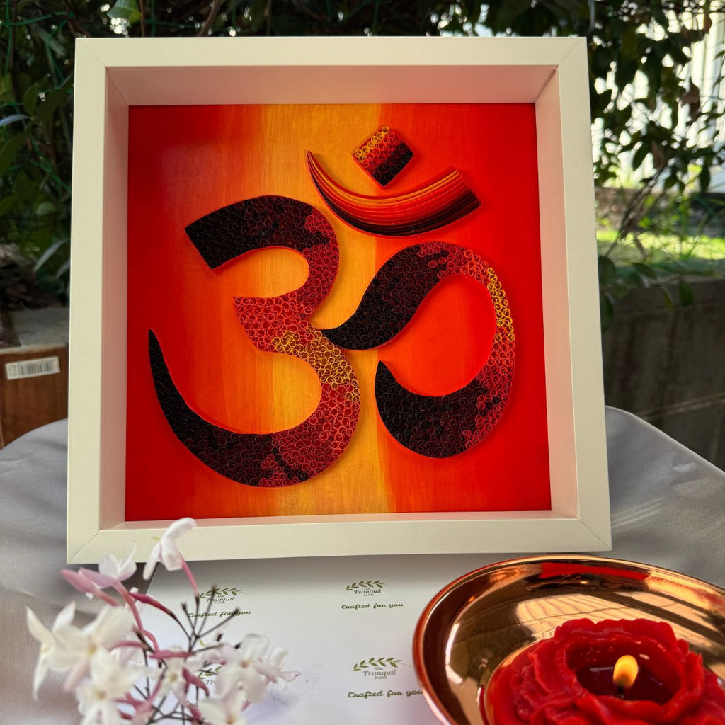 One-of-a-kind paper quilling OM artwork inspired by a red, orange and gold twilight horizon, framed in white MDF