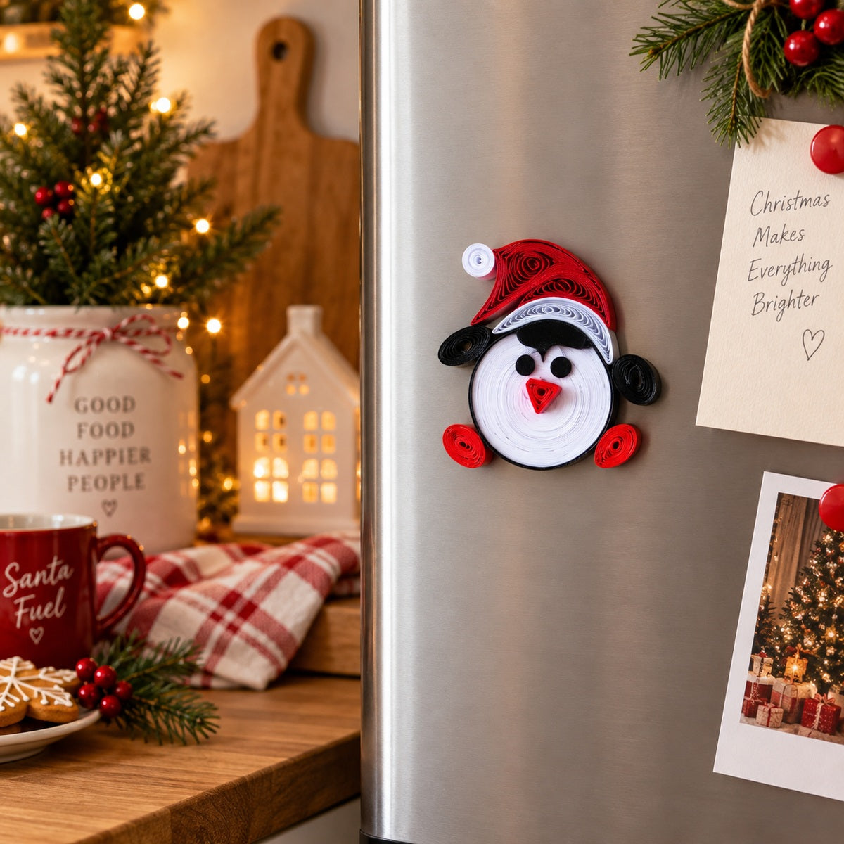 Handmade Santa paper quilling fridge magnet styled on a refrigerator in a warm festive Christmas kitchen.