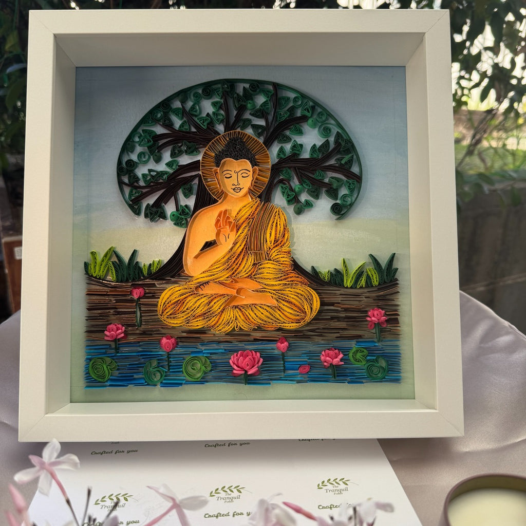 Handcrafted Buddha paper quilling art with intricate golden meditation figure beneath a green Tree of Life