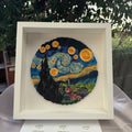 Van Gogh Starry Night paper quilling wall art handcrafted in blue and yellow paper, displayed in a white shadow box frame